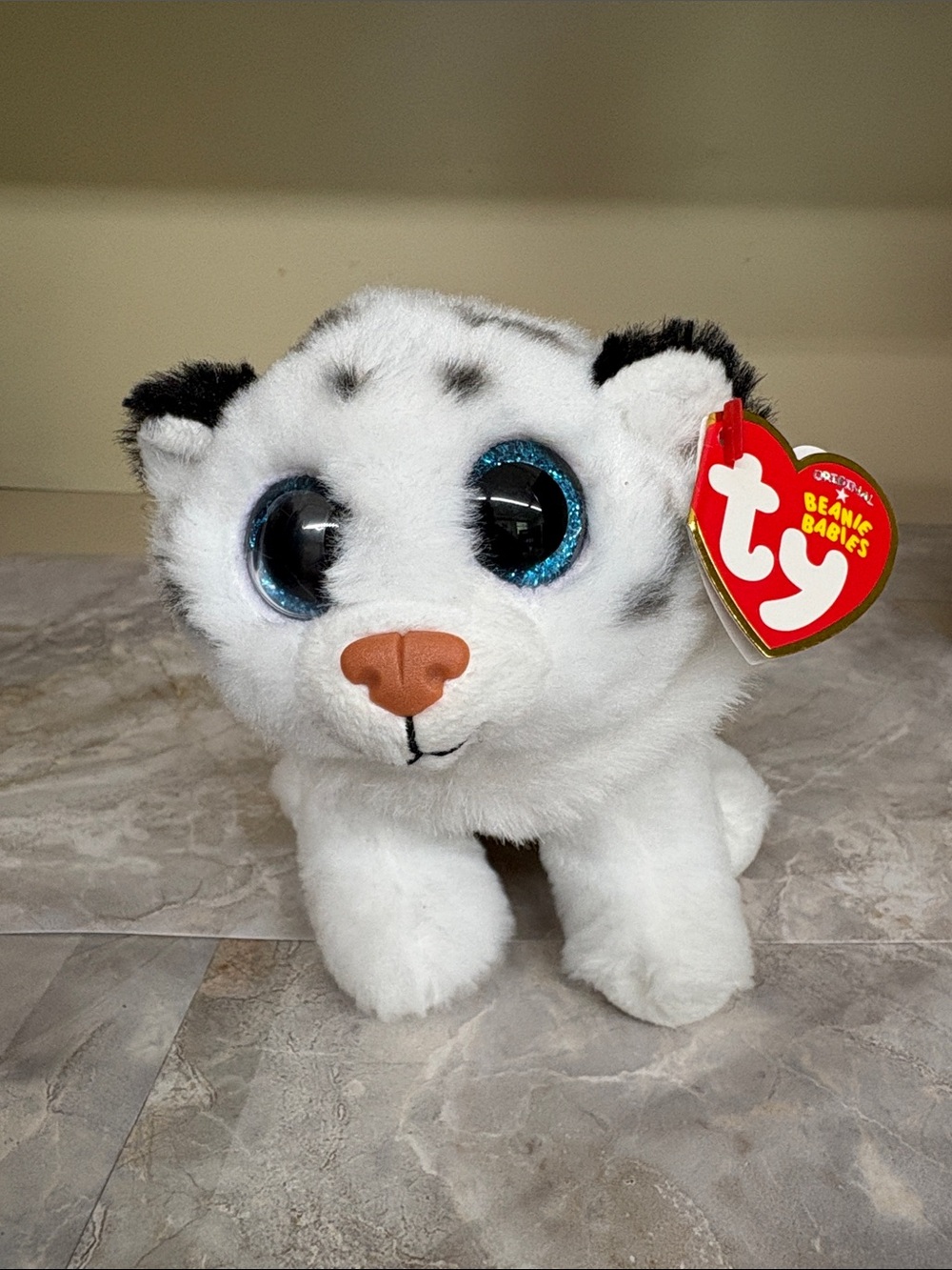 Ty White Snow Leopard Plush with Sparkly Blue Eyes